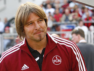NUREMBERG, GERMANY - SEPTEMBER 12:  Head coach Michael Oenning of Nuernberg smiles before the Bundesliga match between 1.FC Nuernberg and Borussia Monchengladbach on September 12, 2009 at the Easy Credit Stadium in Nuremberg. (Photo by Alexandra Beier/Bongarts/Getty Images)